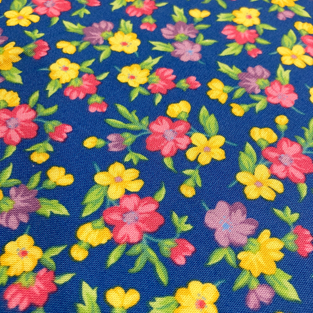 Multi-Color Blossoms on Blue Fabric